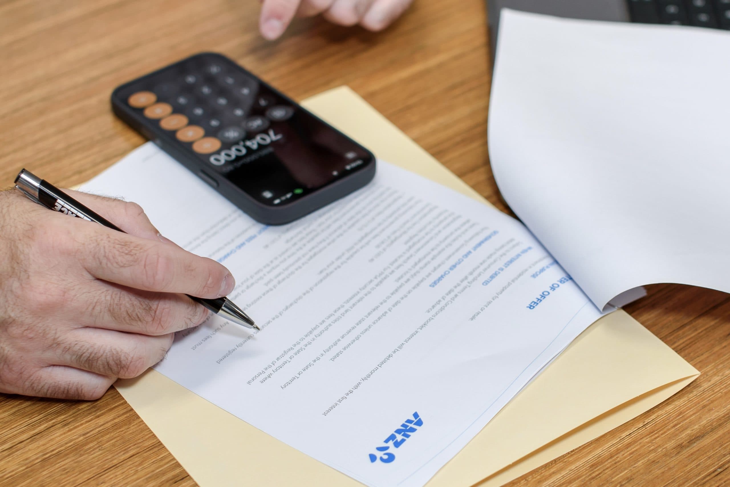 Couple reviewing refinance options with their broker