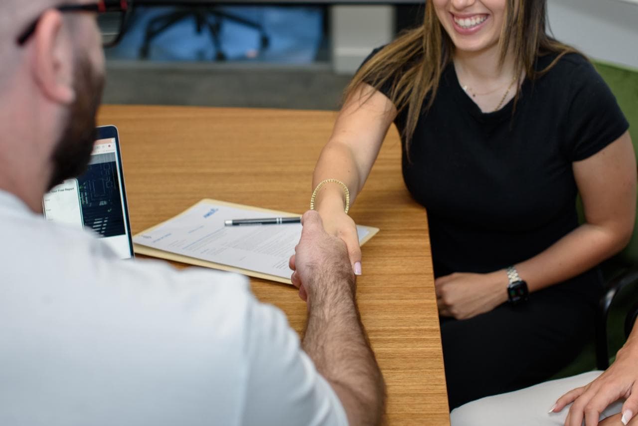 Property investor reviewing options with broker